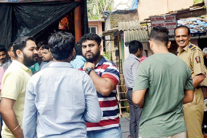 Concerned neighbours seen at Barve Nagar in Ghatkopar, where Pawar lived