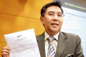 Malaysia's civil aviation chief quits over MH370 lapses