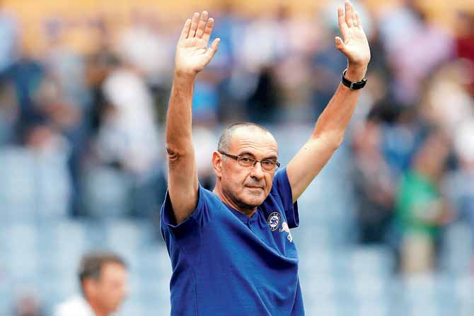 Chelsea manager Maurizio Sarri applauds fans after the match