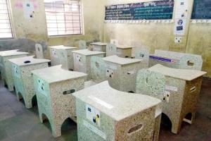 Bandra civic school students study on benches carved from cartons