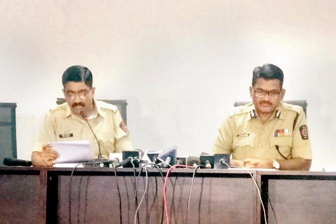 Pune police spokesperson DCP Shirish Sardeshpande (left) reads out a scripted  statement after the SC order, while Jt CP Shivaji Bodkhe listens in