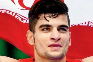 Iranian Wushu fighter picks up injured Surya Pratap Singh in a sporting gesture