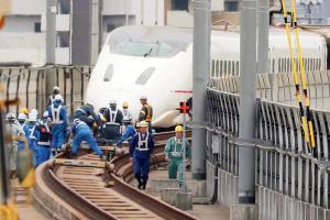 Japan bullet train staff made to sit by tracks as part of safety training