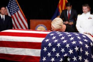 John McCain's family touches casket; wife Cindy kisses it