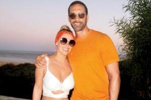 Kate and Rio Ferdinand wear matching orange outfits in Portugal