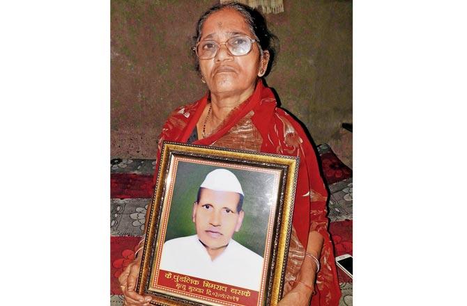 Laxmi Baske with a picture of her husband, Pundalik Baske
