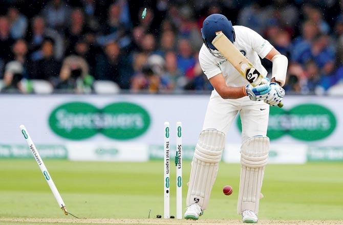 Pujara is bowled by Broad yesterday. Pic/Getty Images