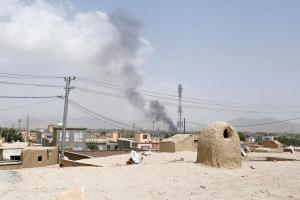 Smoke rises from a residential area in the city of Ghazni where militants are holed up. Pic/AFP