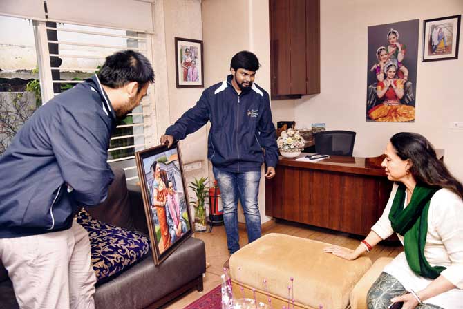 Founder Karan Bhangay (left) and artist Tharun Prabhakar with the painting