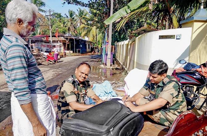A BSF team assists in relief efforts. Pics/PTI