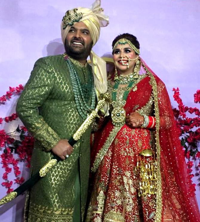 Kapil Sharma made a late entry at the wedding venue, which was done up in red and gold. Ginni stuck to the traditional for her attire and accessorised her look with maatha patti, nath and statement earrings and a layered neckpiece.