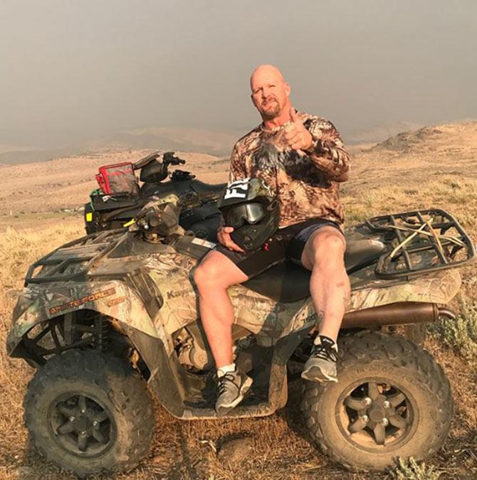 Stone Cold Steve Austin having a great day in his 4x4, he captioned, 'Hell of a day w @neilwiegand on the 4 wheelers. Got a ride in before the smoke got bad. #nevada #4x4 #bruteforce #kawasaki'