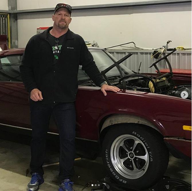 Stone Cold Steve Austin shared this picture with a modified red car in Texas