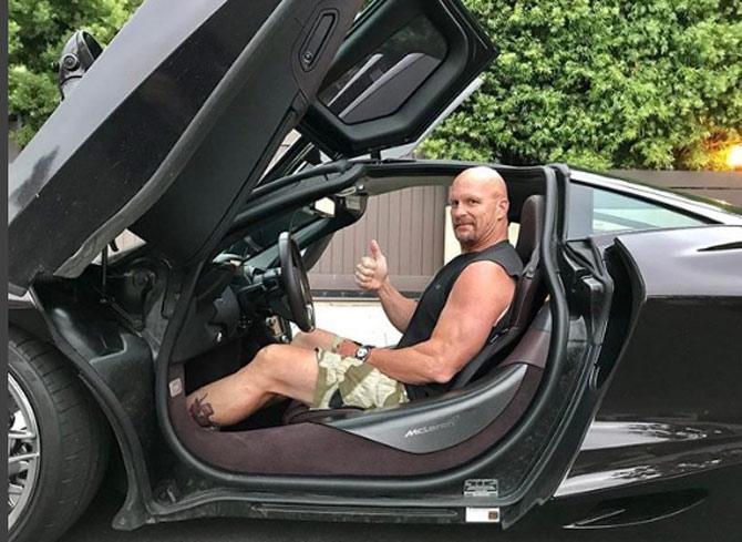What do you think about this brand new car that Stone Cold Steve Austin has bought? He captioned, 'Many thanks to @motorator for bringing the awesome McLaren 720S to 316 Gimmick St. Unbelievable car and I only went 50mph on the mean streets of Los Angeles'