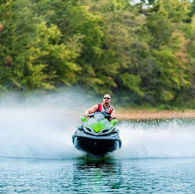 Stone Cold Steve Austin is an absolute 'Stunner' IN THE WATERS. hE CAPTIONED THIS PICTURE, 'Photo session with super cats @chriscarey and @NathanMowery on Lake Hartwell, GA. @KawasakiUSA'