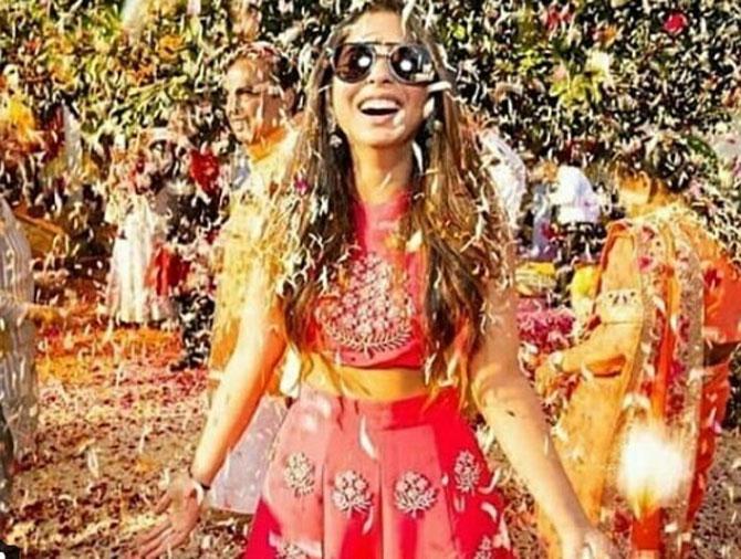 In photo: Isha Ambani caught in a candid moment from her 'Phoolo ki Holi' celebrations which took place in Udaipur.
