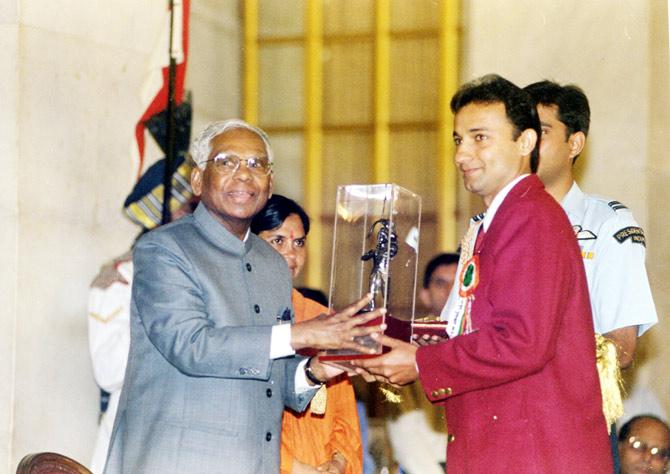 In pic: Nayan Mongia collecting an award at an event in the 1990s