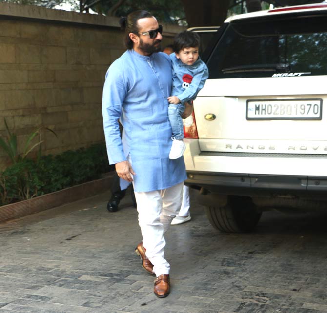 Saif Ali Khan looked dapper in his traditional attire of a blue kurta and white pyjamas as he arrived for the annual Kapoor's Christmas brunch with son Taimur Ali Khan and wife Kareena Kapoor Khan.