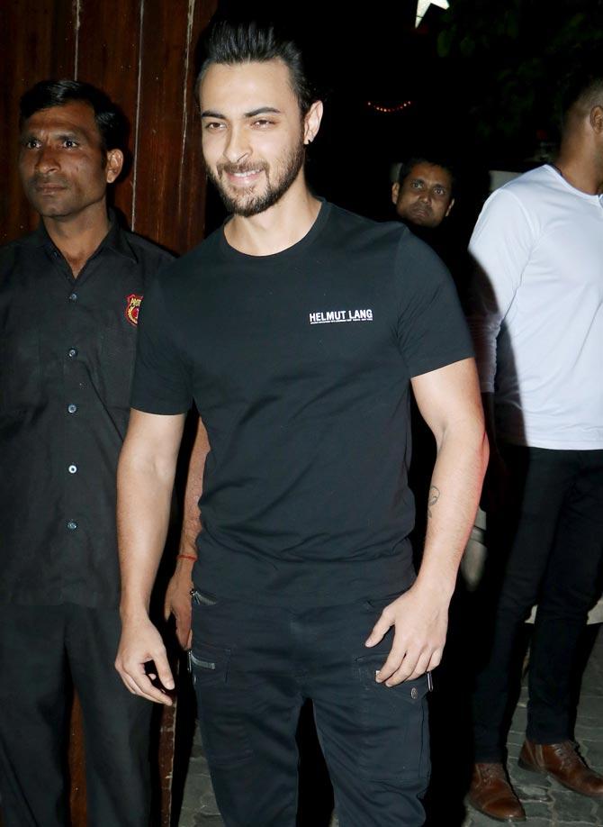 Aayush Sharma, who made his Bollywood debut with LoveYatri, posed for the cameras, before joining the Christmas bash.