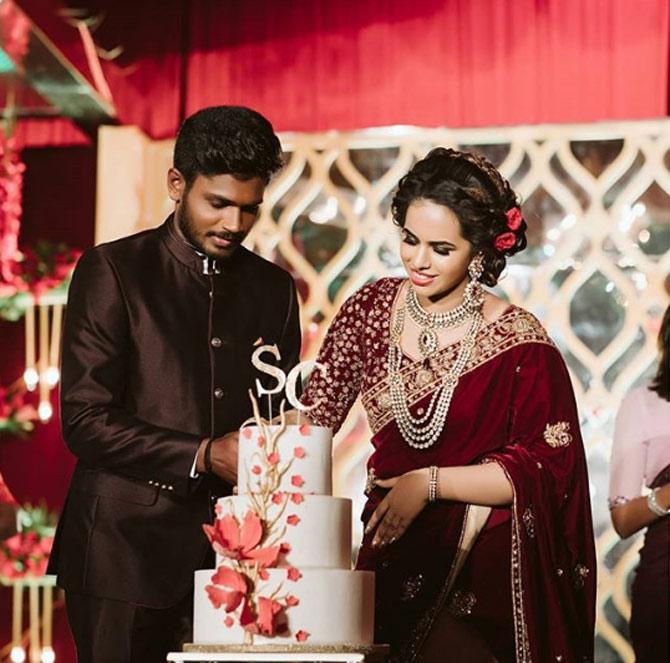 In picture: Sanju Samson and Charulatha cutting the wedding cake on their big day.