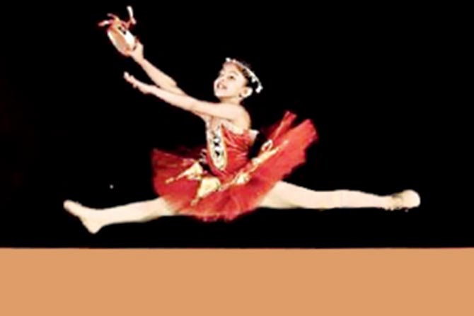 Aarna Kangale, eight, performs a jete at the competition