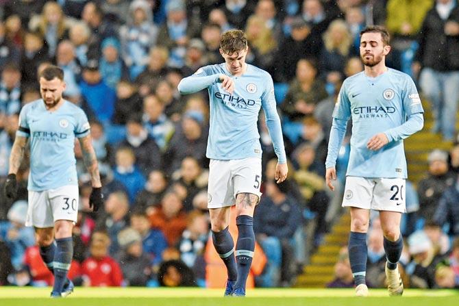 Manchester City players are dejected after Crystal Palace