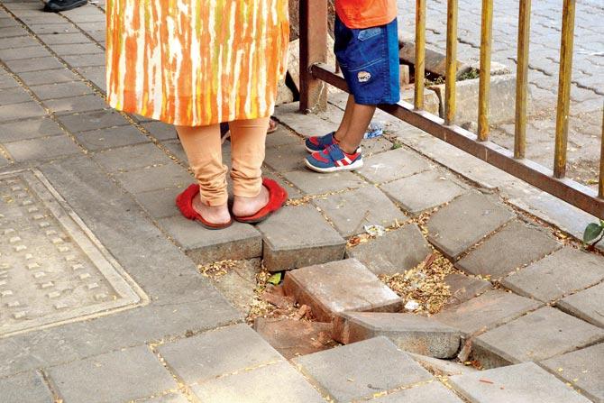 Broken footpaths here force children to walk in the middle of traffic