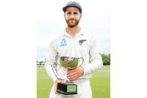 New Zealand captain Kane Williamson with the ANZ Test series trophy in Christchurch yesterday. Pic/AFP