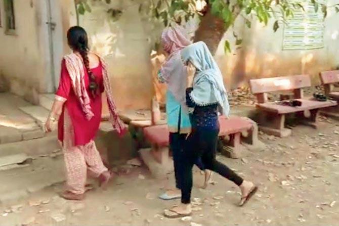 The Pant Nagar police escort Dolly and Zara to the police station
