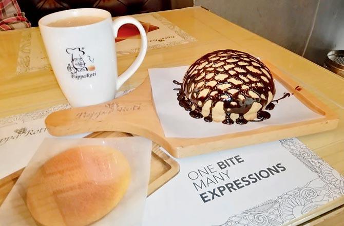 Pappa milk tea with signature bun with dark chocolate drizzle