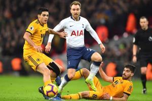 English Premier League: Tottenham stunned by Wolves Tottenham Hotspurs Danish midfielder Christian Eriksen (C) vies with Wolverhampton Wanderers Portuguese midfielder Ruben Neves (R) during the English Premier League football match between Tottenham Hotspur and Wolverhampton Wanderers at Wembley Stadium in