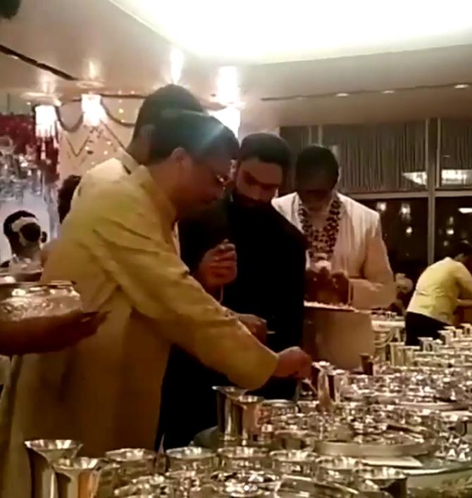 Amitabh Bachchan serving guests at the Ambani wedding