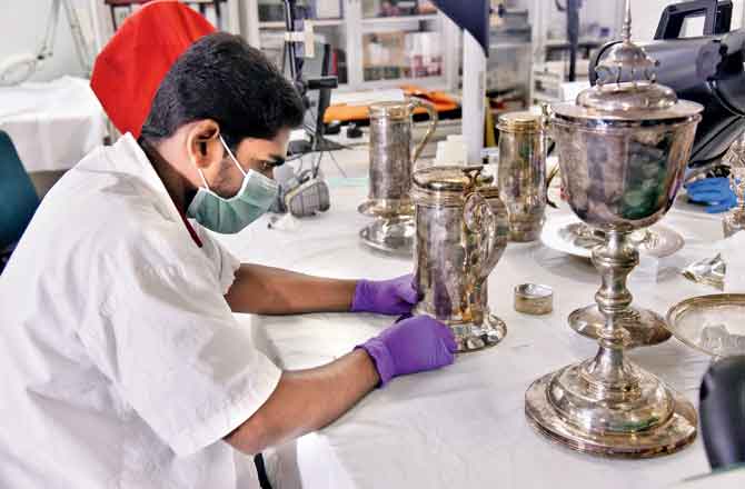 The conservation team polishes silverware including chalices, cups and flagons by using basic mild solvents to remove the tarnish