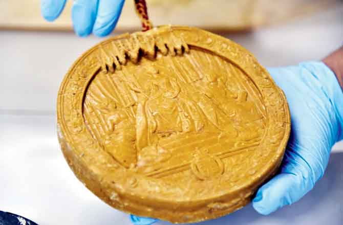 The wax seal reveals a mould outlining the reigning Queen Victoria in whose name this royal decree was issued