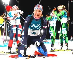 Anastasiya Kuzmina tastes third Winter Olympic gold in biathlon mass start
