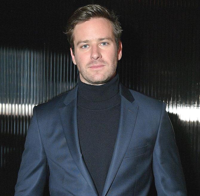 Actor Armie Hammer poses for a photo at BOSS Menswear - Front Row at New York Fashion Week Mens