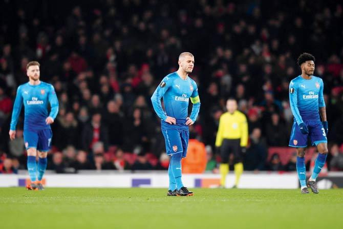 Jack Wilshere (centre) is dejected after Arsenal concede a goal against Ostersund during the Europa League tie on Thursday. Pic/Getty Images