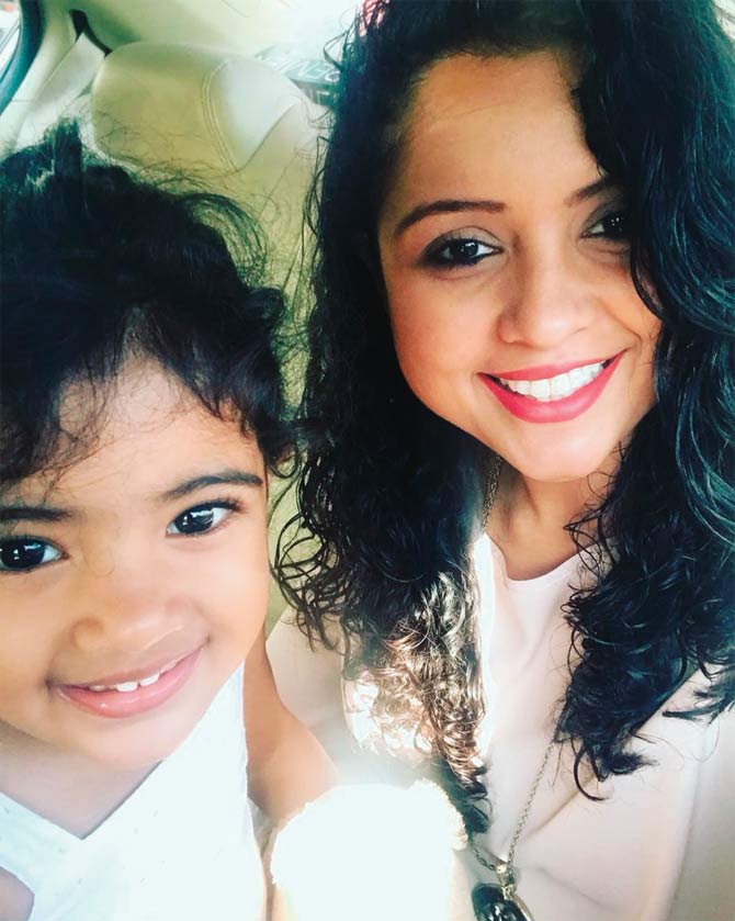 Ravichandran Ashwin with wife Prithiv and daughter