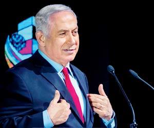 Netanyahu charged with 'breach of trust', refuses to step down