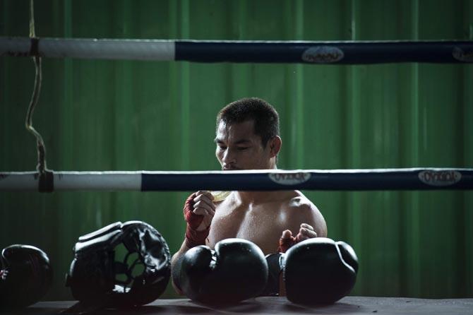 This photo taken on January 31, 2018 shows the current World Boxing Council (WBC) mini-flyweight champion, Wanheng Menayothin, taking out his mouthguard during a training session in Bangkok. Unsung outside the boxing world, the Thai fighter nicknamed the "dwarf giant" is quietly closing in on Floyd Mayweather