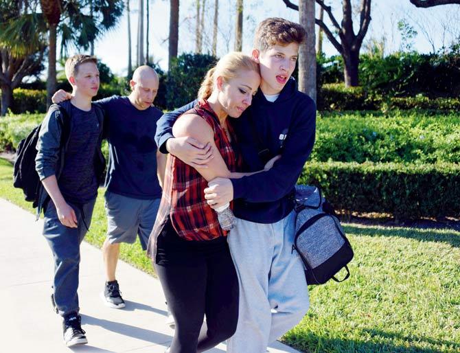 Students react following a shooting at Marjory Stoneman Douglas High School in Parkland, Florida, on Wednesday. Pics/AFP