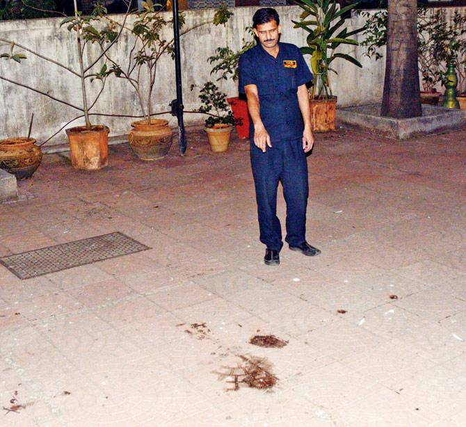 The security guard points to spot where Raju fell
