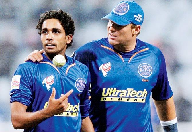 RR skipper Shane Warne has a chat with pacer Kamran Khan during an IPL match v KKR in 2009. Pic/AFP