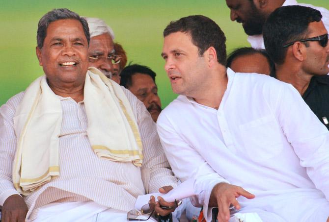 Congress President Rahul Gandhi and Karnataka CM Siddaramaiah during the Janashirvad yatra at Athani taluk in Belgavi district on Saturday . Pic/PTI
