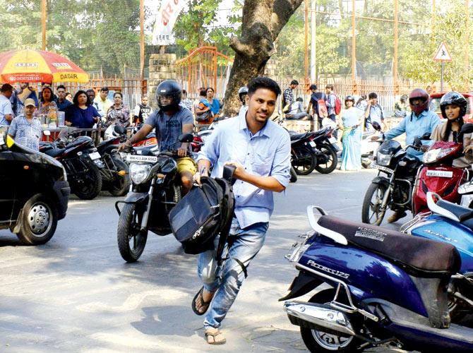 A student arrives late for the exam at Ruia College. Six such students were allowed last minute entry. Pics/Ashish Raje