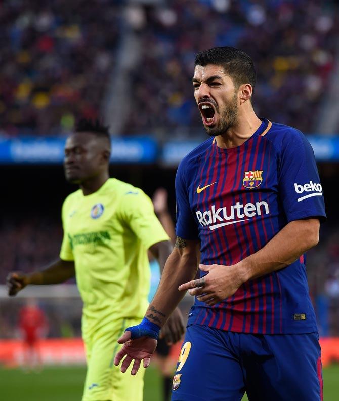 Barcelonas Uruguayan forward Luis Suarez protests during the Spanish league football match between FC Barcelona and Getafe CF at the Camp Nou stadium in Barcelona on February 11, 2018. Pic/ AFP