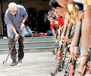It's better late than never for hockey coach Marzban Patel at age 68!