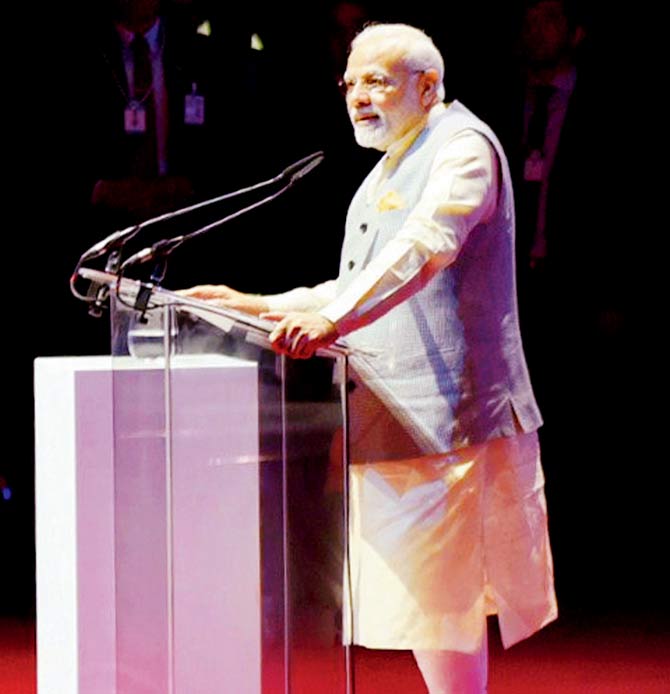 Prime Minister Narendra Modi addresses the Indian community at Dubai Opera where he launched a project for construction of the first Hindu temple in Abu Dhabi. Pic/PTI