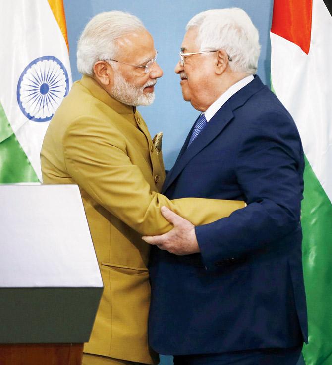 PM Narendra Modi and Palestinian President Mahmoud Abbas embrace after their joint press conference in Ramallah. Pic/AFP