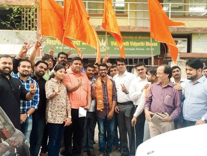 Omkar Bhopi (centre, with saffron scarf) was declared the winner of the Mumbai University student elections on February 2